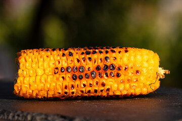 Fresh and delicious grilled sweet corn. Detail of tasty roasted corn