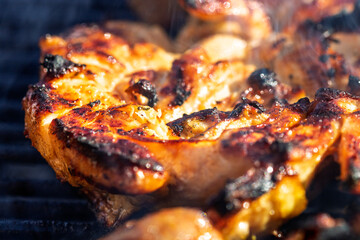 Pork chops, steak, sausages on barbecue grill
