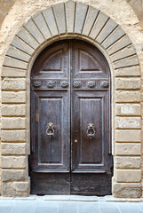 old wooden door in a stone wall