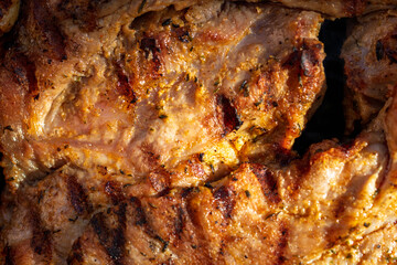 Pork chops, steak, sausages on barbecue grill