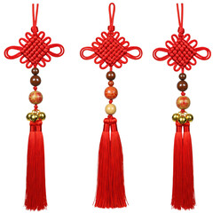 Obraz premium Three chinese knot tassels with beads and red strings, traditional decoration isolated on transparent background