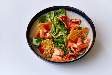 Fresh Salad Bowl with Mixed Greens, Cherry Tomatoes, Crispy Tortilla Chips, and Sliced Meats Perfect for a Healthy Meal Option or Appetizer