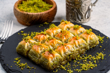 Turkish dessert pistachio baklava on vintage background. Special mini baklava