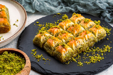 Turkish dessert pistachio baklava on vintage background. Special mini baklava