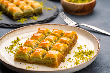 Turkish dessert pistachio baklava on black background. Special mini baklava