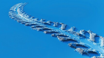 Aerial view of snow-covered mountain range against clear blue sky