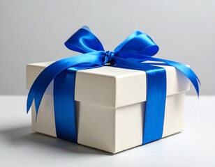 Elegant Gift Box with Blue Satin Ribbon on Neutral Background