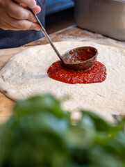 Pizza Sauce with a ladle