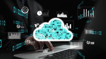 A businessman interacts with a laptop while accessing cloud storage, surrounded by data visualization graphics and statistics, symbolizing modern digital business solutions. Xenic