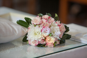 Elegant floral arrangement resting on a sleek surface, exuding romance and joy for a special occasion in a beautifully decorated setting