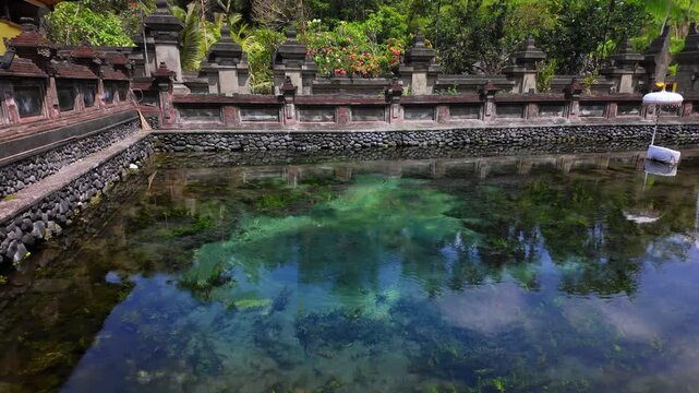 Picturesque view of pool spring water in Pura Tirta Empul Temple on Bali, Indonesia