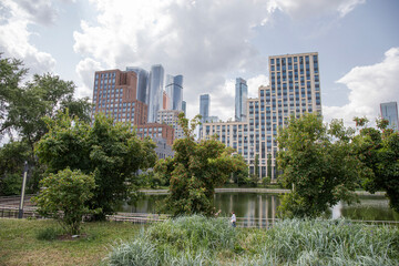 Obraz premium City park and skyscrapers in Moscow