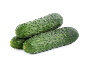 Three fresh green cucumbers isolated on white
