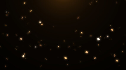 Orange and yellow confetti on an black background. Particles glitter shimmers and sparkles in light. Festive background for holiday, birthday, wedding, party, new year