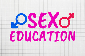 Sex Education inscription, male and female gender symbols on squared paper