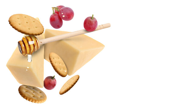 Cheese, grapes, crackers and honey in air on white background. Tasty appetizers for cheese board