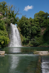 Naklejka premium The Cascata Grande is formed by the left arm of the Liri River and is approximately 27 meters high:one of the few waterfalls to be found in the historic center of a city, unique in Italy and in Europe