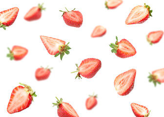 Fresh juicy strawberries flying against white background