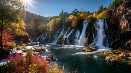 Obraz premium Majestic waterfall cascades through autumn forest