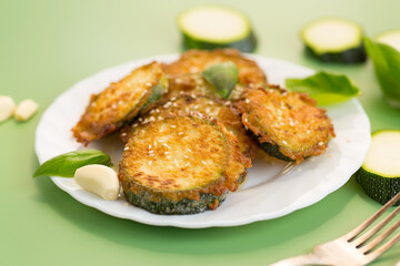 Appetizing zucchini slices in garlic sauce with herbs