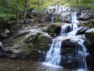 The scenic beauty of Dark Hollow Falls, nestled within the woodland forest of Shenandoah National Park, Virginia. The waterfall is a popular hiking destination.for outdoor enthusiast.