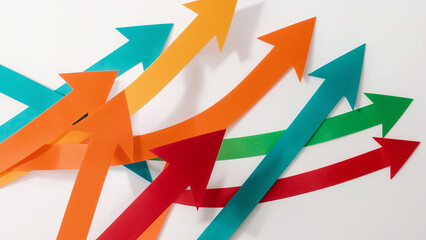 Overlapping colorful paper arrows in a dynamic upward motion on white direction growth