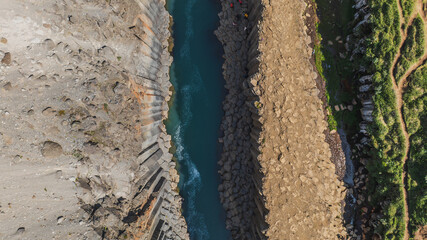 Aerial View of Icelandic Canyon with Basalt Columns and Turquoise River