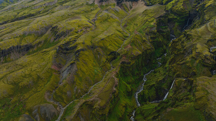 Aerial View of a Lush Green Canyon with Waterfalls in Iceland