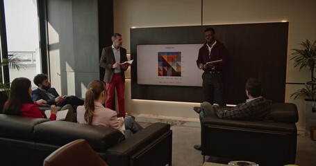 A diverse business team collaborates on a project, analyzing data and discussing growth strategies in a modern office. - Powered by Adobe