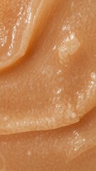 Fototapeta premium Luxurious Orange Exfoliating Scrub Texture. Close-up Cosmetic Cream or Natural Mineral Background.