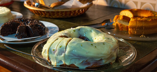 
Hearty breakfast served with cakes, pies, jams, pastries, cheese, ham, coffee, milk, cheese bread and much more