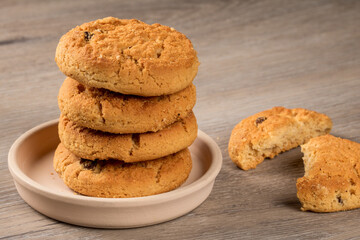 Cookie lovers delight: raisin dessert cookies on a rustic table setting