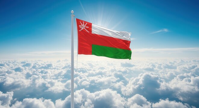 Oman National Flag Waving on Tall Flagpole in Sky with Clouds – Oman Independence Day Celebration, Patriotism, Freedom, Omani Culture & Heritage