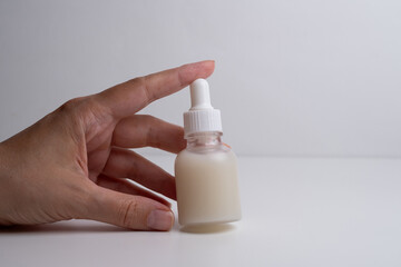 A jar of spa cream in the hands of a girl. Skin care. Medical and dermatological cosmetics for hands. Beauty and health of a woman. Spa treatments for the body. Container with natural cream close-up