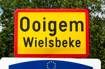 Fototapeta premium Road sign of the village of Ooigem Wielsbeke, West Flanders, Belgium