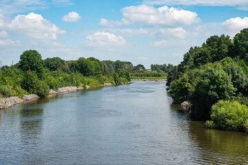 Fototapeta premium Green surroundings of the river Lys or Leie in Desselgem Waregem, West Flanders, Belgium
