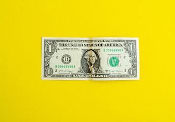 Dollar on a yellow background, background with copy space.