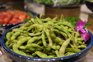 Green Japanese Soybean in white bowl on table wood and Dried flower . High quality photo