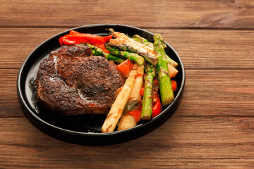 Grilled steak served with fresh vegetables for a hearty dinner