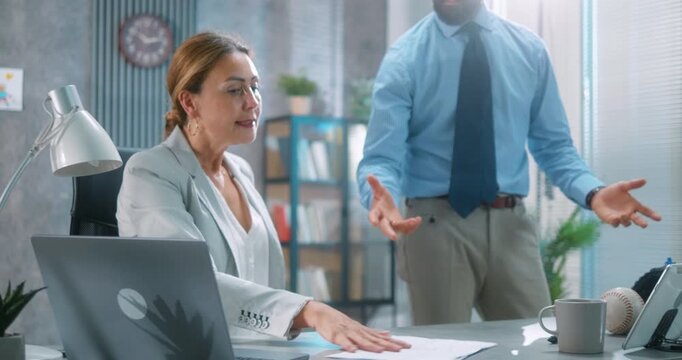 Frustrated businessman approaches female coworker&rsquo;s desk, throws project document with visible anger. She reacts upset, leading to an intense workplace argument. Part 27 of the &ldquo;Dad&rsquo;s Day&rdquo; series.