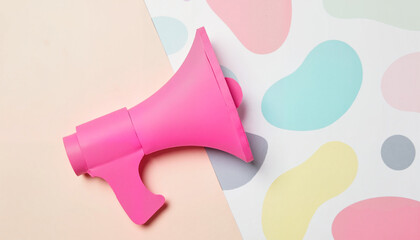 Vibrant pink megaphone on abstract pastel backdrop, artistic expression