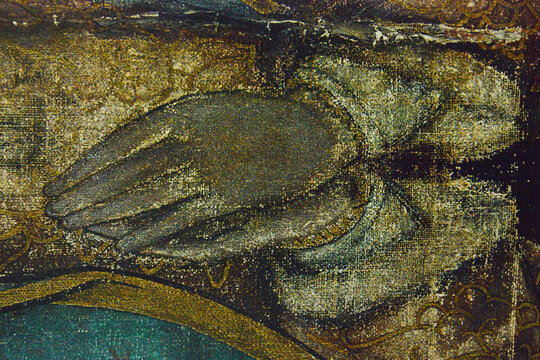 Detailed Virgin of Guadalupe's hands of the original sacred tilma (the photography was made over one of the certified prints from one official digital file scaned on 1999).