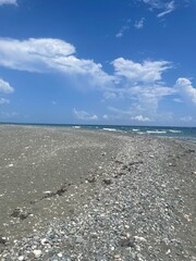 Rocky Beach Shoreline Beneath a Clear Blue Sky