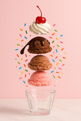 Delicious ice cream dessert with vibrant toppings against a pink background