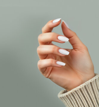 Hand with white squoval nails manicure, ai generated, green background