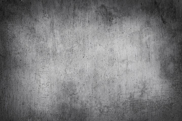Obraz premium Dark grey grunge wall texture. Abstract background of dark, heavily textured surface reminiscent of old concrete, plaster or metal.