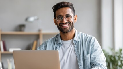 technology remote job and lifestyle concept  happy indian man in glasses with laptop computer working at home office no logos no brands ar 169