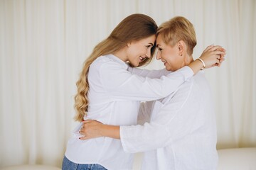 Mother and daughter embracing, sharing a tender moment of love and complicity