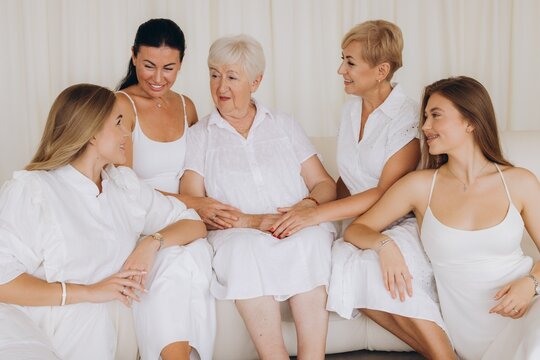 Family of women sharing a moment of affection on a sofa