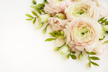Summer blossoming delicate ranunculus on blooming flowers festive background, pastel and soft bouquet floral card, selective focus